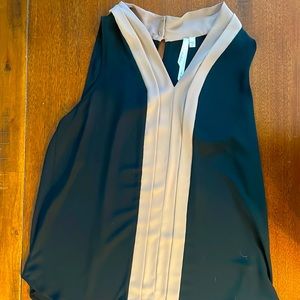 Black and beige sleeveless blouse